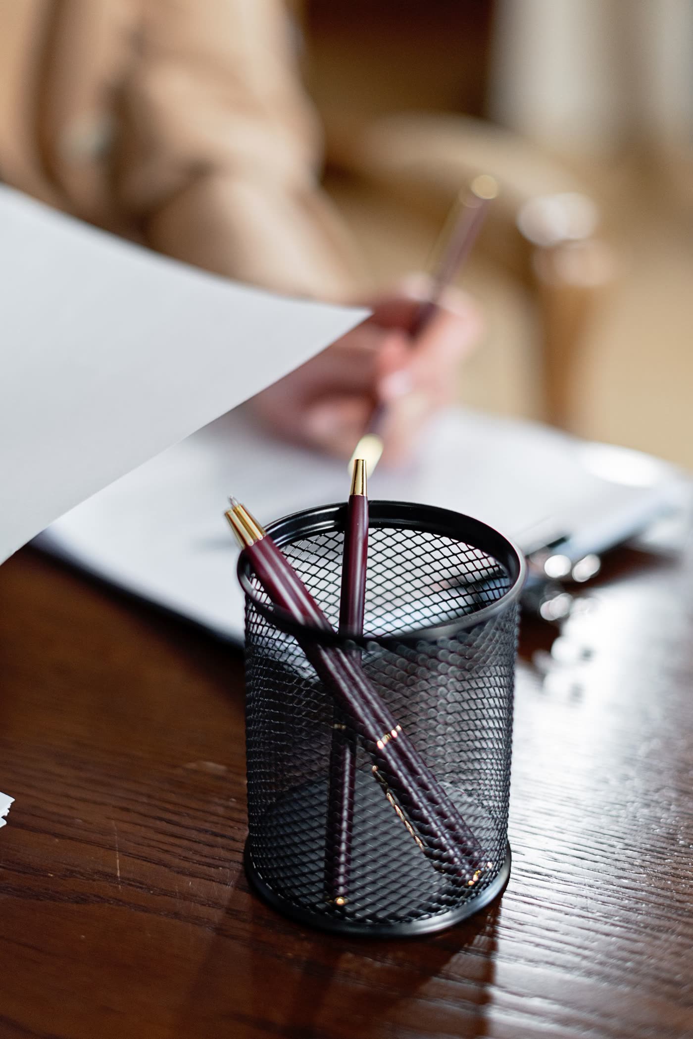 A tidy desk with documents and reading glasses